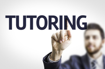 Business man pointing the text: Tutoring