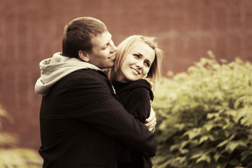 Happy young couple in love on the city street