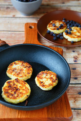 pancakes in a frying pan and on the plate