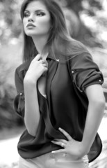 beautiful young woman with makeup in fashion clothes