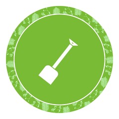 Pelle dans un panneau vert