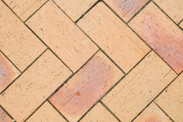 Pale red brick pavement pattern