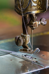 Old sewing machine and needle.