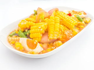 Hot and spicy Thai corn salad on white dish