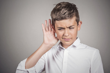 Curious young man secretly listening in on private conversation