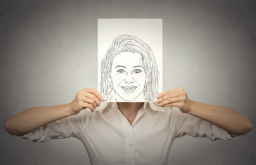 Beautiful woman with happy self portrait in front of her face
