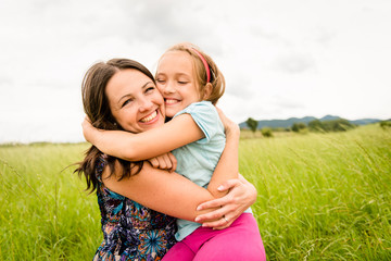 Mother and child hugging