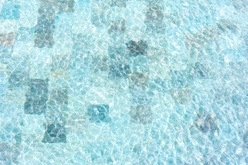 Fototapeta na wymiar Texture of water surface in swimming pool