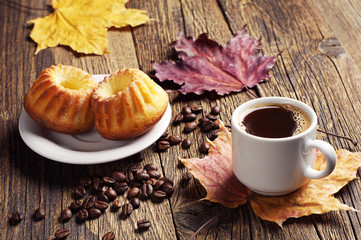 Coffee, cupcake and autumn leaves