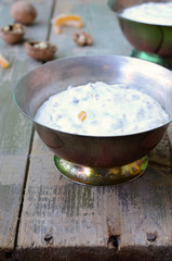 Homemade creamy cottage cheese with walnut and sugared orange