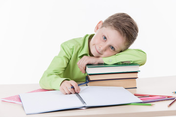 Caucasian student boy doing homework.