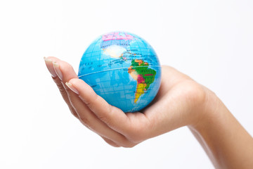 woman's hand with globe