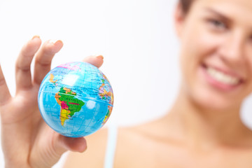 woman's hand with globe