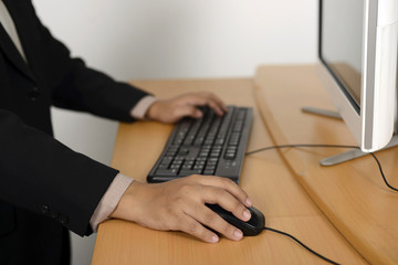 Business man typing with keyboard