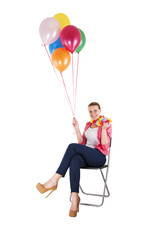 woman with balloons over white background smiling