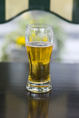Glass of beer on table