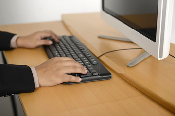 Business man typing with keyboard