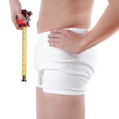 close up of man on white boxer underware measuring penis isolate