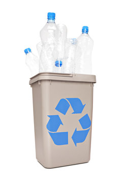 Studio shot of a recycle bin full of plastic bottles