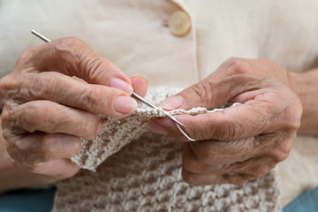 older woman crocheting