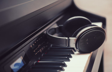 Headphones on a digital piano keyboard