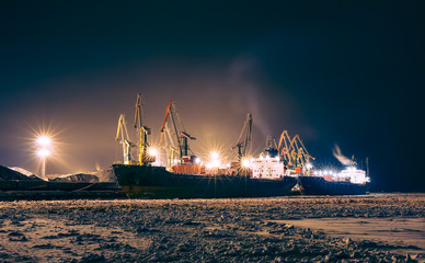 Cargo ship in the northern port at the night
