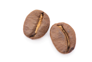 Brown coffee beans isolated on white background
