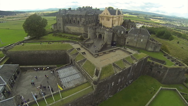 Camera flying over Stirling castle in Scotland.