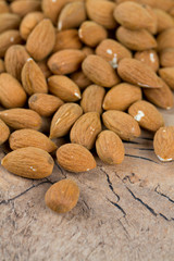 almond nuts on wooden surface