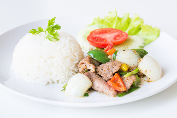 Pork with Fried Black Pepper and rice on White Background.