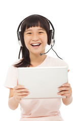 happy asian little girl holding a tablet with earphone