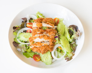 Fried Chicken salad with tomatoes,  Cucumber and Onion.