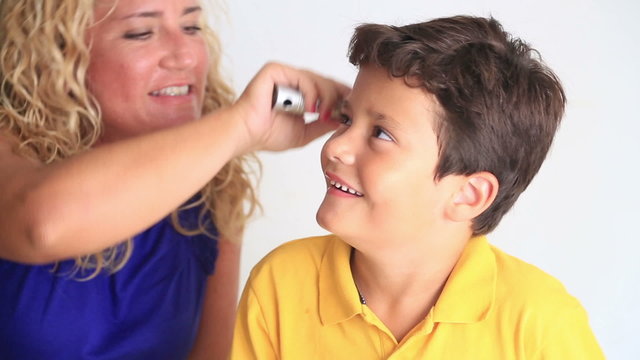 Mother Combing Little Boy's Hair