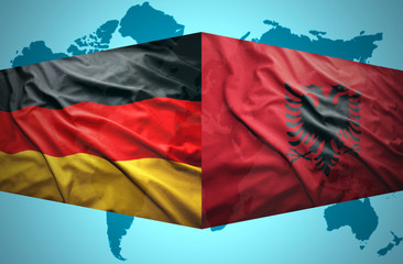 Waving Albanian and German flags