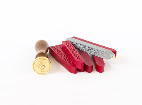red sealing wax candles with stamp isolated on white background 