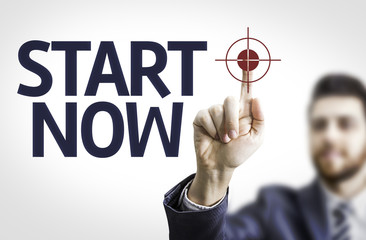 Business man pointing the text: Start Now