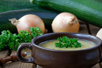 Fresh homemade zucchini soup with onions and parsley