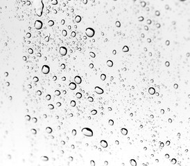 Fototapeta na wymiar Background of water drops on glass