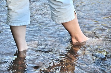 A woman walking in water