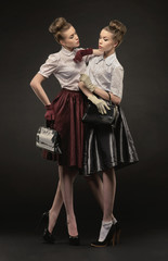 Two pretty sisters in retro style