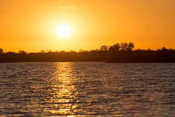 Fototapeta na wymiar beautiful dawn sun on the lake