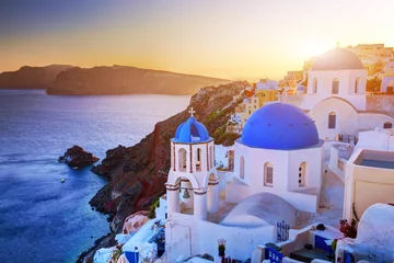Fotobehang Oia town on Santorini island, Greece at sunset. Aegean sea. © Photocreo Bednarek