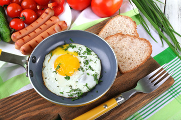 Scrambled egg with sausage and vegetables served