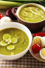 Leek soup on table, close up