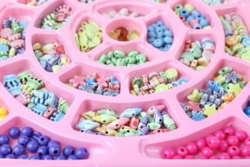Multicoloured beading kit for children in a pink box
