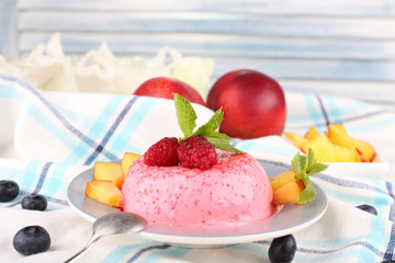 Heart shaped cake with fruits and berries on plate on