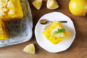 Tasty lemon dessert on wooden table