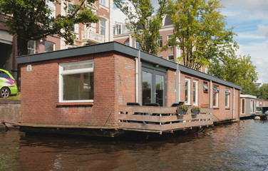 Brick house on water. Amsterdam, Holland