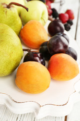 Naklejka na ściany i meble Ripe fruits and berries on table close up