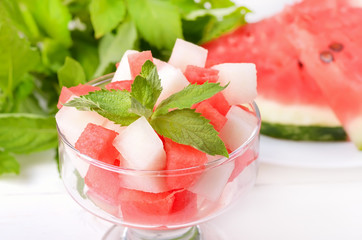 Watermelon and melon slices in glass